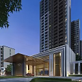Modern Residential Entrance Building With High Rise Towers And Landscaped Surroundings