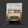 Old Yellow Truck Model With Rusty Body And White Roof On Grass And Pavement Base