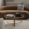 Modern Living Room Interior with Brown Curved Sofa Round Coffee Table and White Armchair