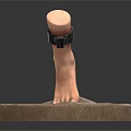 Man's Foot Model With Ankle Chain Displayed On Round Stone Base