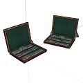Two Open Wooden Cases With Green Interiors And Colorful Items Inside