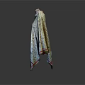 Patterned Shawl With Pink Trim On Mannequin Against Gray Background