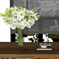 White Lilies and Roses in Clear Vase on Wooden Table with Blinds and Green View