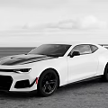 White Sports Car Featuring Black Stripes Sleek Design And Black Wheels On Open Ground