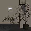 Decorative Bare Branches In Terracotta Pot With Framed Picture And Warm Lighting