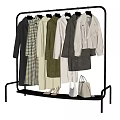 Fashionable Clothes Hanging On Black Rack With Coats Dresses Shoes And Bags