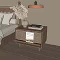 Cozy Bedroom Wooden Bedside Table with Woven Design Vase Dried Flowers and Books