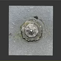 Japanese Stone Lantern Structure With Carved Pedestal And Surrounding Stones On Gray Ground