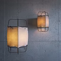 Modern Pendant Lights With Metal Frame And Fabric Shade Against Gray Wall