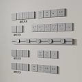 Various Types Of Button Switches With Different Panel Designs Arranged On White Wall