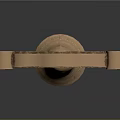 Brass Colored Arched Gate With Hanging Bell Carved Intricate Decorations And Shiny Reflections
