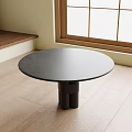 Round Black Dining Table With Unique Base On Wooden Floor Near Window 3d model