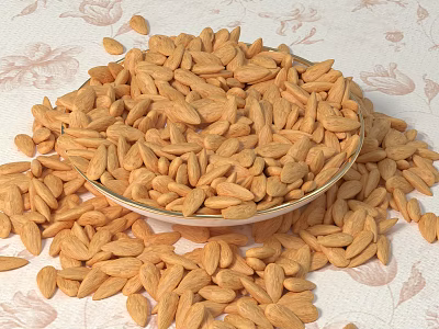 Bowl of Almonds with Scattered Nuts on Patterned Tablecloth Surface 3d model