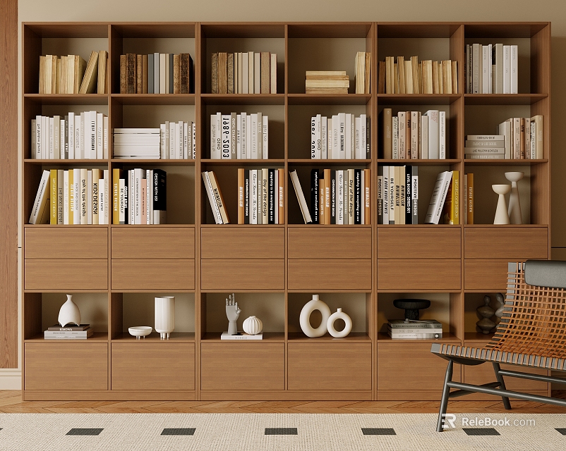 Wooden Bookcase With Multiple Compartments Filled With Books Decorative Items And A Woven Chair Beside 3d model 
