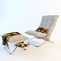 Comfortable Light Gray Accent Chair With Plaid Cushion And Ottoman With Tassel Blanket