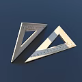 Two Stainless Steel Triangular Rulers With Measurement Scales On Dark Surface