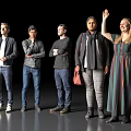 Diverse Group of People Standing Together With Various Poses On Dark Background And Gray Floor