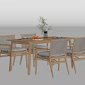 Wooden Dining Table With Four Chairs Plant In Vase And Oranges On Tabletop