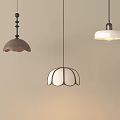 Stylish Pendant Lights In Brown And White With Unique Designs Hanging On Beige Wall