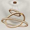 Modern Gold Chandelier with Intertwined Circular Rings and Transparent Glass Balls for Contemporary Interior Lighting