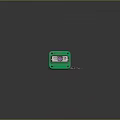 Mobile Digital Component With Green Enclosure Purple Lens And Multicolored Cables