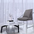 Modern Gray Leisure Chair With Metal Frame Side Glass Coffee Table Vase Books Laptop Curtain