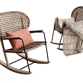 Rattan Leisure Rocking Chair With Pink Cushion Black Metal Frame And Geometric Pattern Blanket
