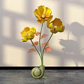 Floral Display Featuring Yellow Flowers in Green Snail Shaped Vase with Light Wall Shadow