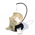 Modern Rattan Hanging Chair With White Cushion Green Blanket And Black Curved Frame