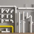 Plumbing Pipes And Fittings Collection With White Yellow Elbows Tees And Joints