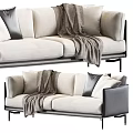 Modern Beige Two Seater Sofa With Gray Throw Blanket And Decorative Pillows
