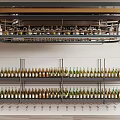 Modern Wine Cabinet With Multiple Shelves Displaying Various Wine Bottles For Home Bar