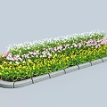 Colorful Garden Decorative Feature With Yellow Pink White Flowers And Stone Edging