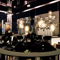 Modern Black Sculptural Furniture With Urban Night Sky And Bookshelf Green Plant