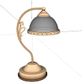 Elegant Metal Table Lamp With Curved Stem Transparent Shade And Carved Base