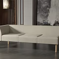 Light Beige Three Seater Sofa with Wooden Legs Against Grey Wall and Artwork