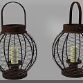 Two Rustic Metal Lanterns With Intricate Wire Designs And Lit Candles Inside