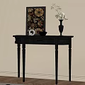 Black Wooden Console Table With Drawer Vase Flowers And Framed Art On Light Wall