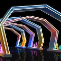 Colorful Illuminated Event Entrance With Geometric Arch Structure And Reflective Floor