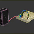 Black Power Supply Connected To White Circuit Board With Blue Component And Red Black Wires