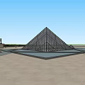 Main Glass Pyramid of Louvre with Smaller Pyramids in Open Square and Blue Sky