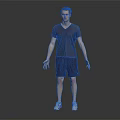 Man in V neck T shirt and shorts standing with sneakers on dark background