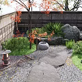 Japanese Style Garden Courtyard with Wooden Buildings Stone Lanterns Small Bridge Pebble Path and Pine Trees