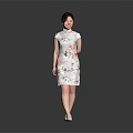 Woman Wearing Traditional Chinese Qipao with Floral Patterns Standing Gracefully