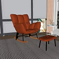 Orange Rocking Leisure Chair With Matching Footstool And Decorative Painting In Modern Interior