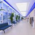 Front Desk Reception Area With Long Corridor Blue Accents Plants Benches And Display Boards