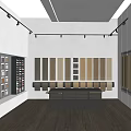 Material Showroom With Wall Mounted Color Texture Panels Central Dark Reception Desk And Wooden Flooring