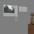 Modern Wall Mounted Doorbell with Screen Displaying Breathe Text Near Light Switches and Decorative Figurine