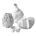 Elegant Handcrafted Decorative Sculptures With Textured Materials And Organic Shapes