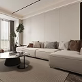 Modern Living Room Featuring Light Sofa Colored Cushions Round Coffee Table And Large Green Plant